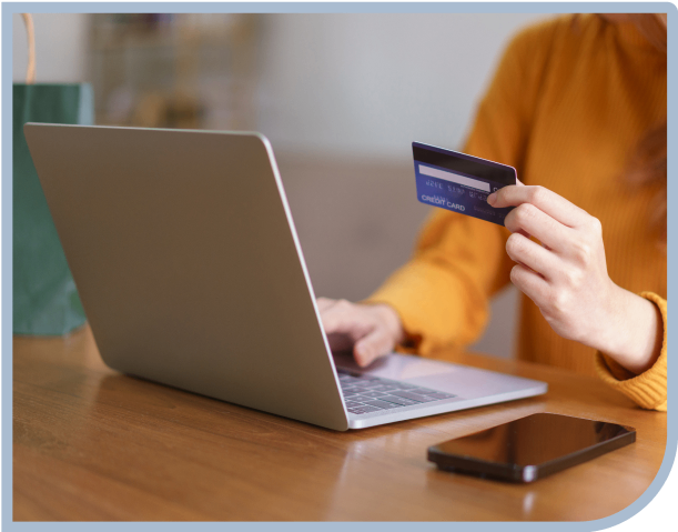 Person shopping online with credit card.