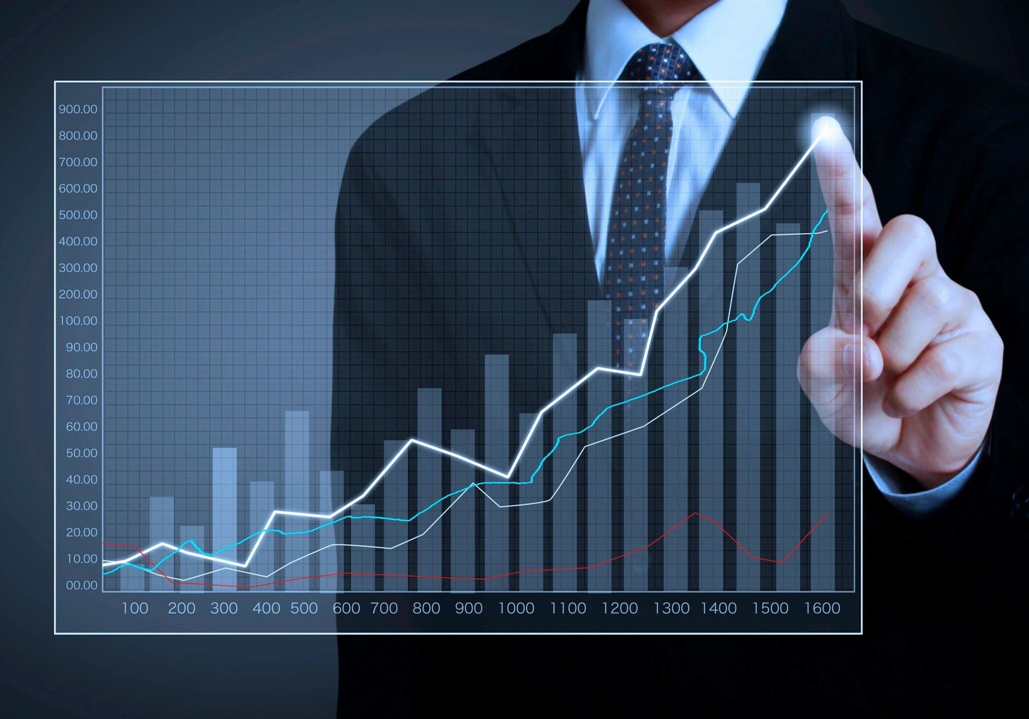 fm=f_1162 A man in a suit and tie holding a glass with a graph on it.